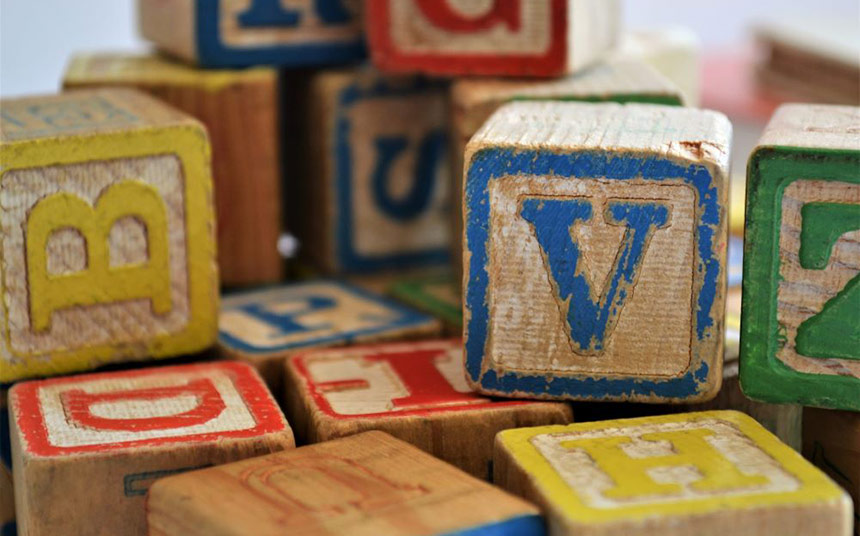 Photo of children's wooden block with letters on them