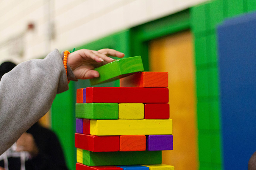 Photo of of a child playing with building blocks