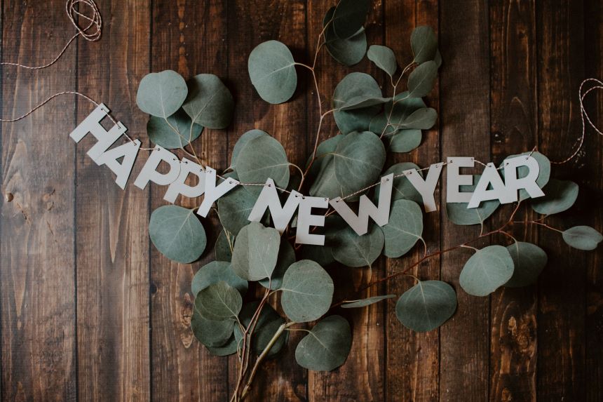 Happy New Year sign with leaves