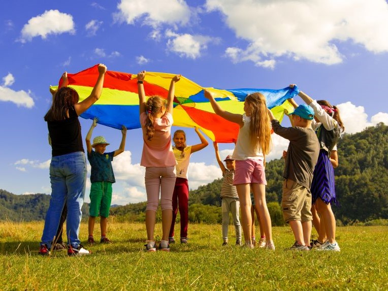Children playing with a parachute.