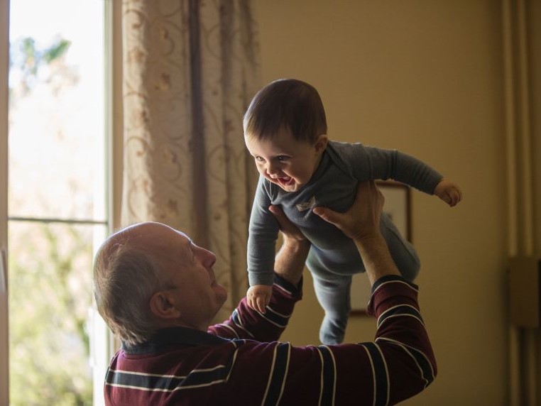 Grandfather and grandchild playing
