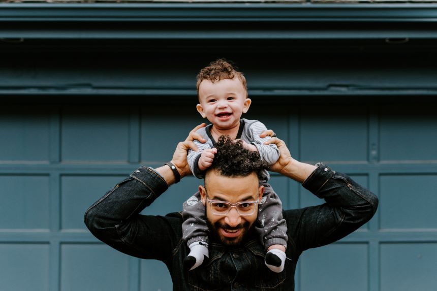 Son on Father's shoulders.