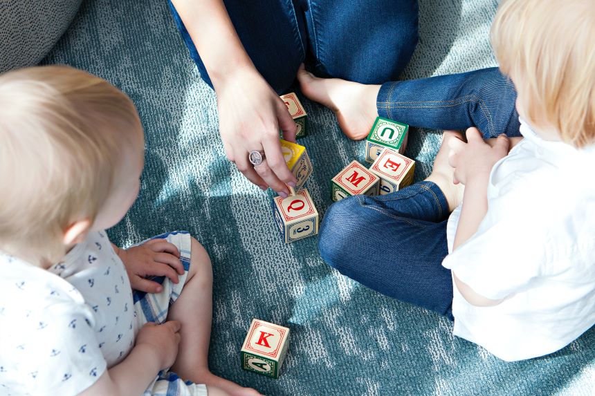Children and parent playing with blocks