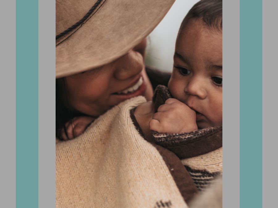 Mother holding child in blanket