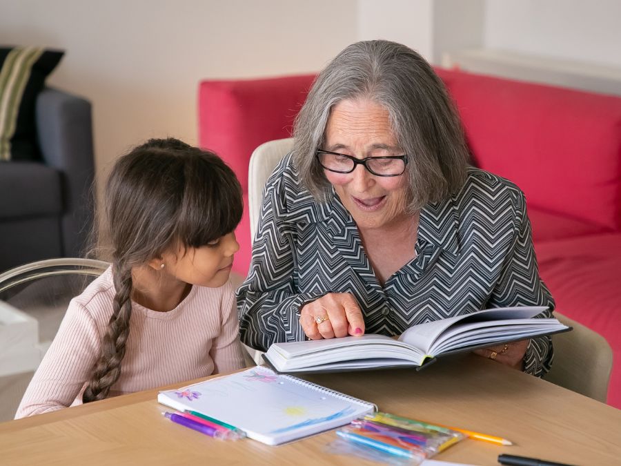 Grandmother reading to child.