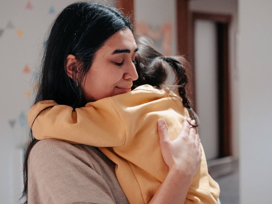 Woman and child hugging