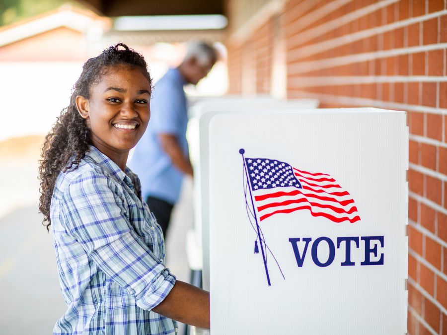 Young girl voting