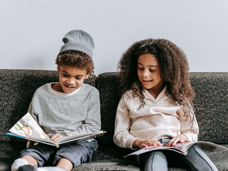 Two kids reading books