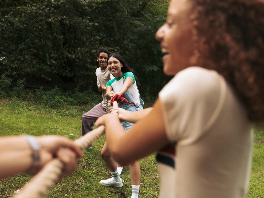 Youth playing a game of tug of war.