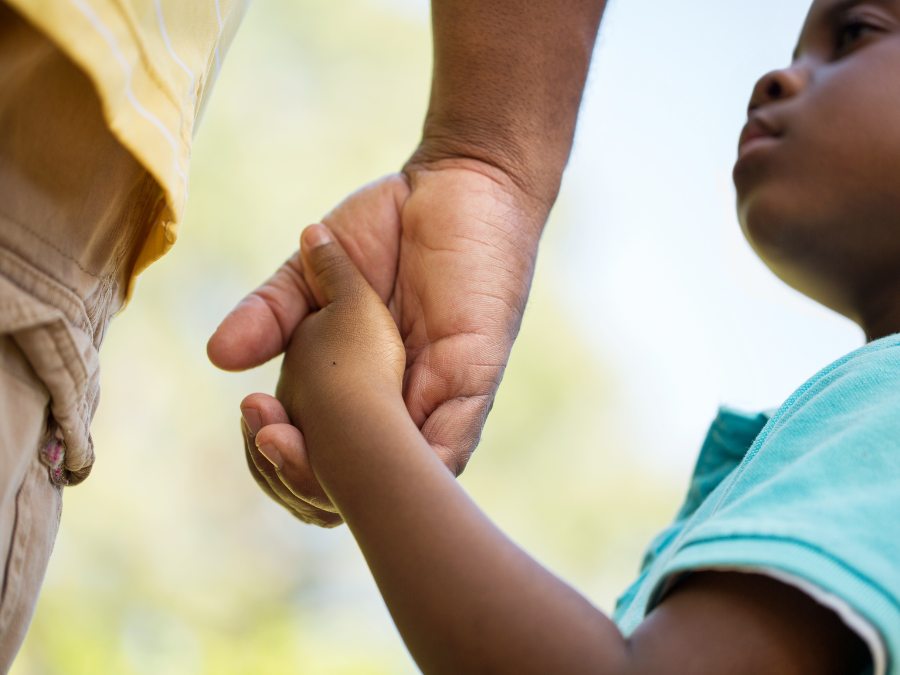 Parent and child holding hands